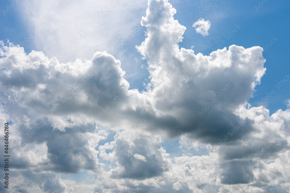 Blue sky white cloud fluffy gray clouds.dramatic blue sky,clouds warm summer day background. Blue sky white cloud fluffy gray clouds.dramatic blue sky,clouds warm summer day background.