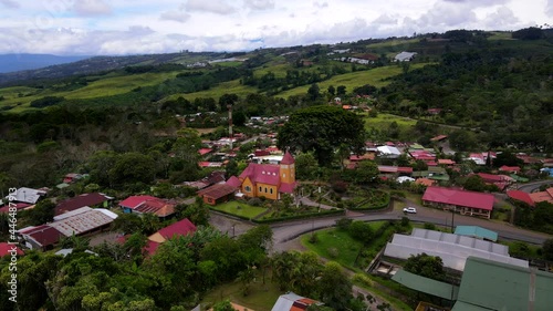 Beautiful aerial view of the Aquiares town and its iconic yellow church in Cartago Costa Rica	 photo