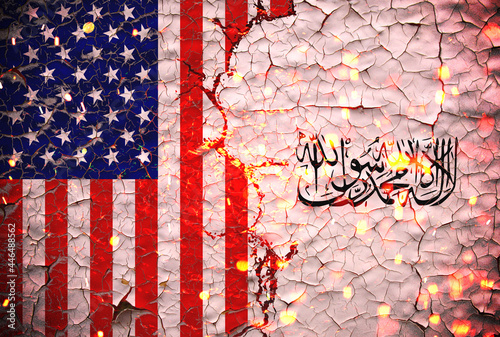 Us and Taliban flags painted over cracked concrete wall.And lava flows behind.Us vs Taliban war. photo