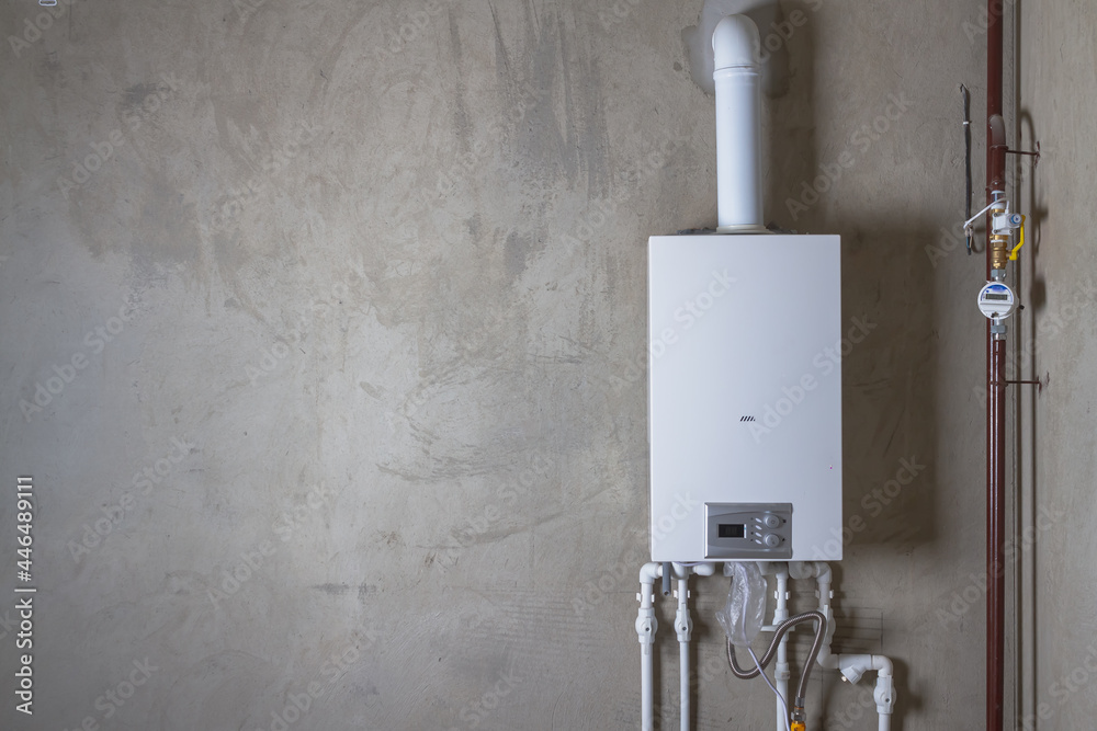 Double-circuit gas boiler in a new house for winter heating and water  heating Stock Photo | Adobe Stock