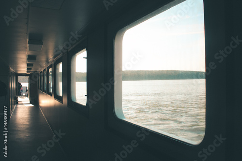 Ferry corridor, square windows, light falls on the floor. Transit from Klaipeda to the Curonian Spit © Илья Батькович