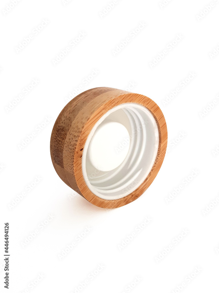 Close up of round wooden screw cap for bottle. Front view of inside of wooden plug. Isolated bottle lid. Ecological and biodegradable utensils and accessories. Close up of round wooden screw cap for bottle. Front view of inside of wooden plug. Isolated bottle lid. Ecological and biodegradable utensils and accessories.