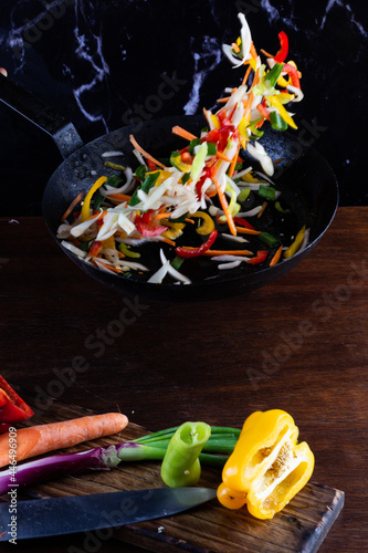 Sauteed colorful vegetables, rustic pan. bell pepper, carrot, onion. fajitas