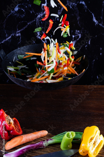 Sauteed colorful vegetables, rustic pan. bell pepper, carrot, onion. fajitas