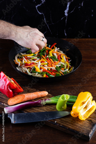 Sauteed colorful vegetables, rustic pan. bell pepper, carrot, onion. fajitas