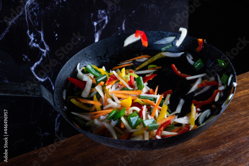 Sauteed colorful vegetables, rustic pan. bell pepper, carrot, onion. fajitas