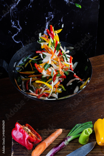 Sauteed colorful vegetables, rustic pan. bell pepper, carrot, onion. fajitas
