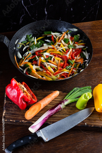 Sauteed colorful vegetables, rustic pan. bell pepper, carrot, onion. fajitas