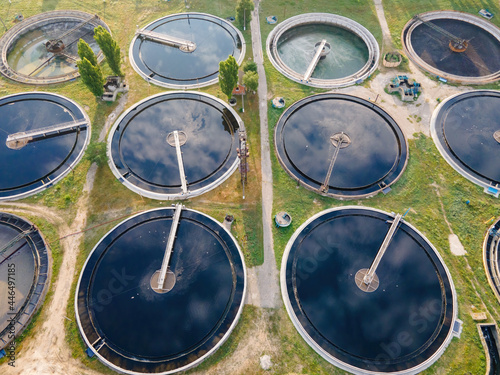 Aerial view of wastewater treatment plant, filtration of dirty or sewage water in near big city © Leonid