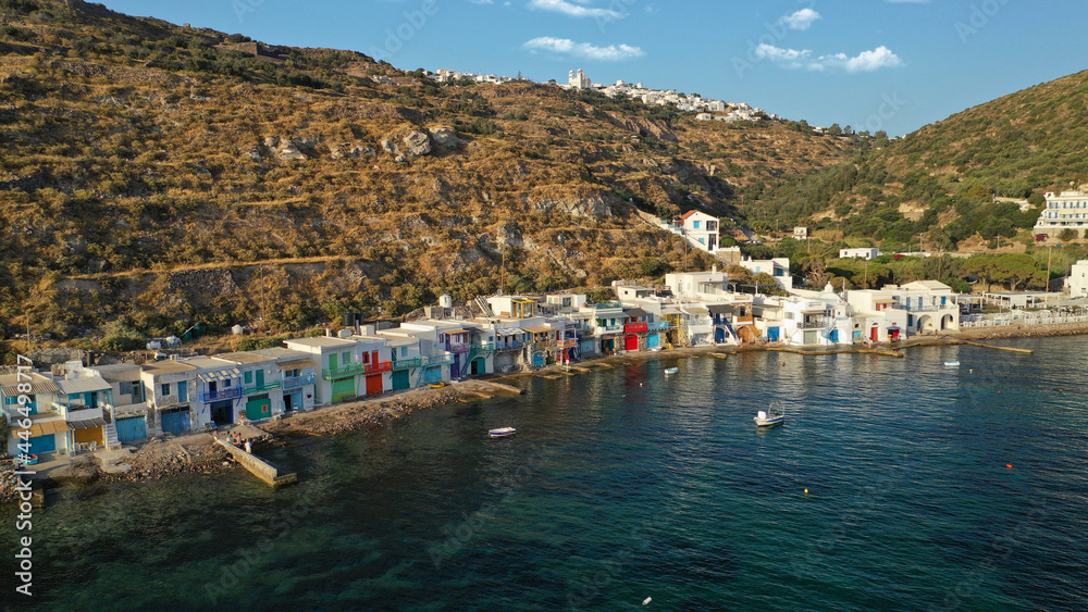 Aerial drone photo of picturesque seaside village of Klima and traditional fishermen settlement with colourful boat garages called syrmata in island of Milos, Cyclades, Greece