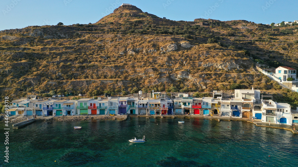 Aerial drone photo of picturesque seaside village of Klima and traditional fishermen settlement with colourful boat garages called syrmata in island of Milos, Cyclades, Greece