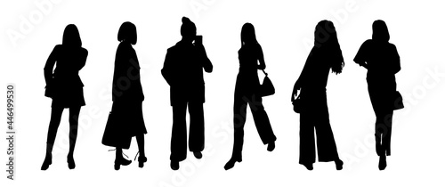 A set of black silhouettes of girls of models in business clothes for printing on T-shirts, mugs, bags, decoration and design. Vector illustration.