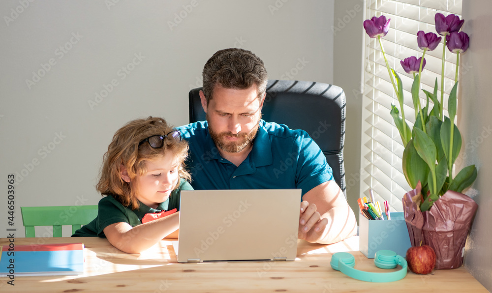 attentive father and child son at school working online on laptop, school attentive father and child son at school working online on laptop, school