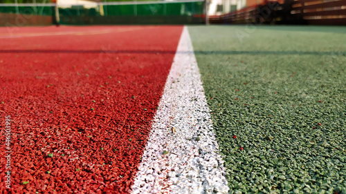 View of white lines on an outdoor tennis court