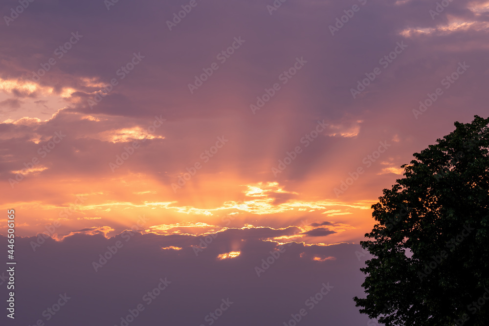 Fototapeta premium Moody orange sunset between the clouds sky