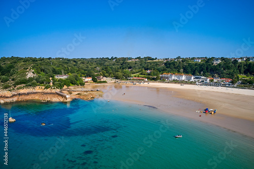 Aerial drone image of part of St Brelades at half tide in the sunshine. Jersey Channel Islands.