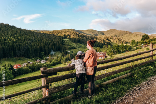 Family vacation in the mountains in summer. Enjoy the sunset in the mountains with the whole family.