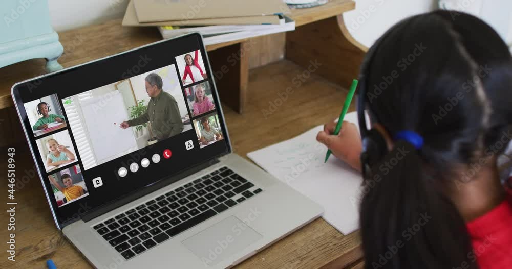 Schoolgirl using laptop for online lesson at home, with diverse teacher and class on screen Schoolgirl using laptop for online lesson at home, with diverse teacher and class on screen