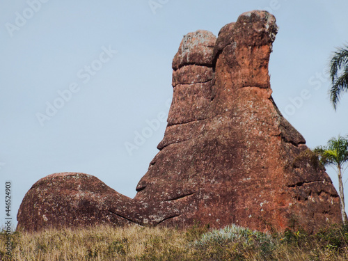 Sandstone rock formations, one of them is the rock in the shape of boots or shoes, a sandstone monument carved by environmental actions belonging to the Vila Velha State Park, Paraná in Brazil.  photo