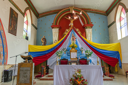 altar con imagenes religosas en catedral de Raquira photo