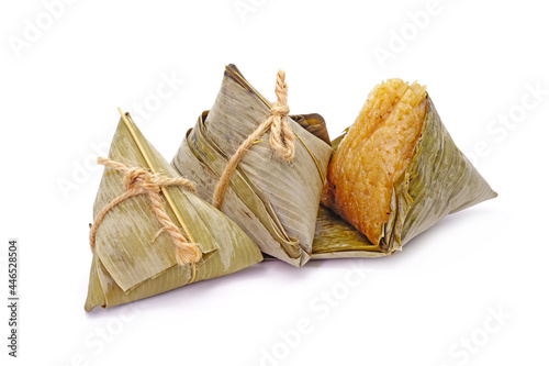 Sticky rice dumpling or Zongzi (Pyramid-shaped dumpling made by wrapping glutinous rice in bamboo leaves) for Chinese Boat dragon festival (5th Lunar month festival. Isolated on white background photo