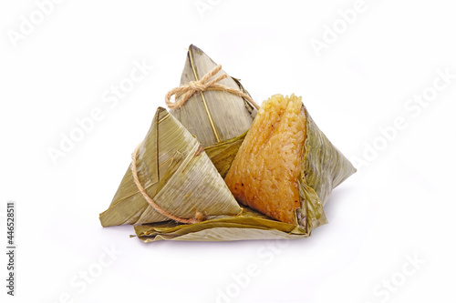 Sticky rice dumpling or Zongzi (Pyramid-shaped dumpling made by wrapping glutinous rice in bamboo leaves) for Chinese Boat dragon festival (5th Lunar month festival. Isolated on white background photo