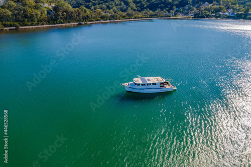 Morning escape - aerial waterscape with boats © Merrillie