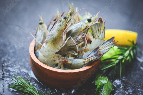 Raw shrimps prawns on ice in bowl, Fresh shrimp seafood with herbs and spice