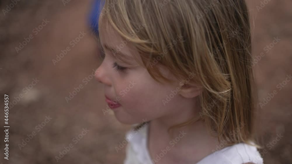 Outdoor portrait of a beautiful, smiling, little girl in slow motion. Outdoor portrait of a beautiful, smiling, little girl in slow motion.