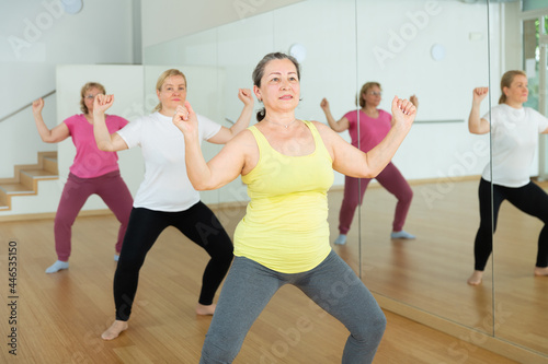 Aged European women are dancing during a fitness training session