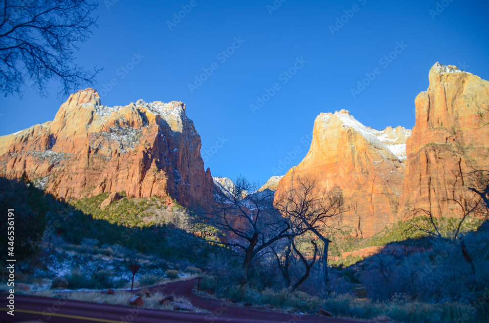 Winter in the American Southwest. Snow Covered Redrock Cliffs Driving Tourism