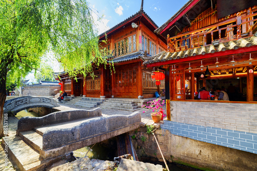 Traditional Chinese carved houses and stone bridges over canal