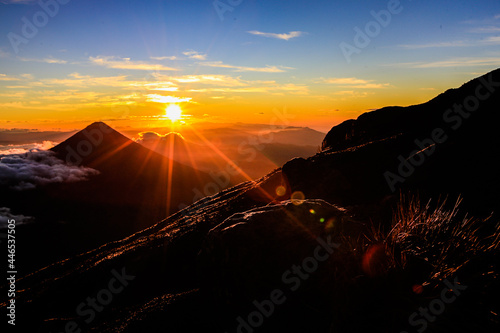 Sun rising  over the Volcano of Agua and view from Volcano of Acatenango in Guatemala photo