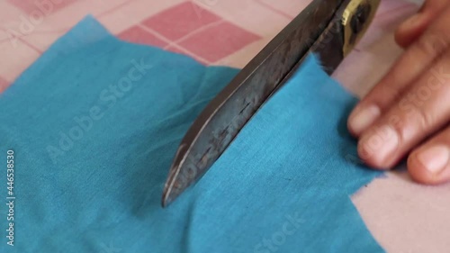 Process of creating from wool fabric cutting along the tailor chalk markings edge 
