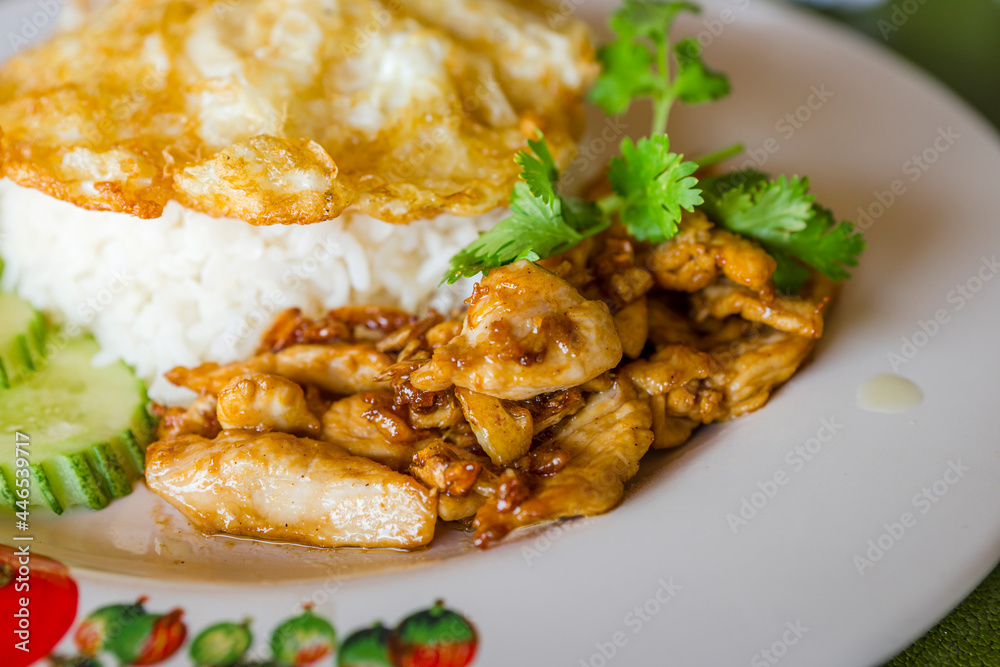 Fried Pork with garlic and fried Egg on rice in delicious lunch , Thai food