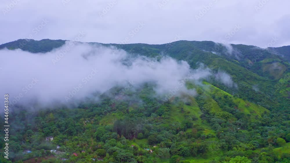 Lush Vegetation At The Mountain Ridges Of Los Mogotes Villa Altagracia During Misty Morning In Dominican Republic. - Aerial Shot Lush Vegetation At The Mountain Ridges Of Los Mogotes Villa Altagracia During Misty Morning In Dominican Republic. - Aerial Shot