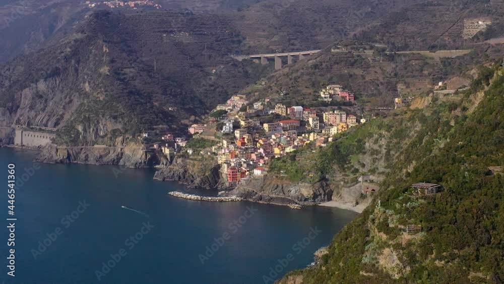 Aerial view around Riomaggiore, in Cinque Terre, Italy - circling, drone shot Aerial view around Riomaggiore, in Cinque Terre, Italy - circling, drone shot