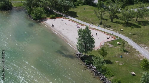 Aerial view of people relaxing at Innisfil beach park on a sunny day, Ontario, Canada photo