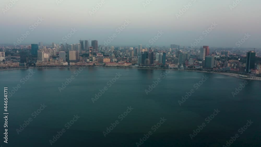 Traveling right, Luanda city, golden hour flying over Luanda bay, Africa Traveling right, Luanda city, golden hour flying over Luanda bay, Africa