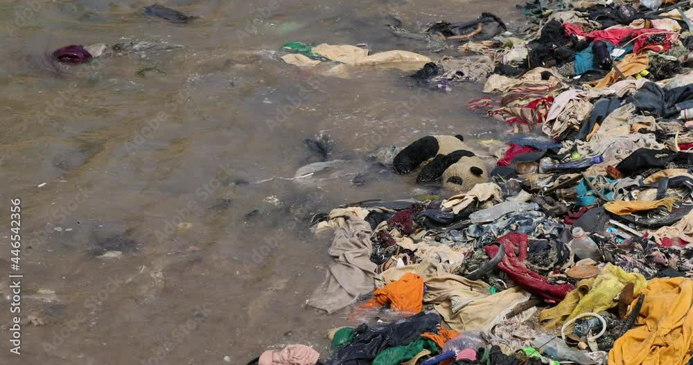 Beach trash Pollution garbage Cape Coast Ghana Africa. Ghana West Africa on the Atlantic ocean. Filthy pollution, trash, garbage and waste wash up on shore. Sandy beaches. Summer vacation destination.