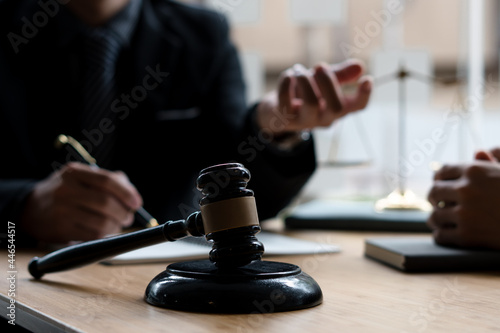 Business lawyer working about legal legislation in courtroom to help their customer