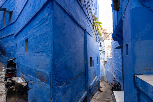 The bright blue color street and houses of the blue city of Jodhpur Rajasthan. photo