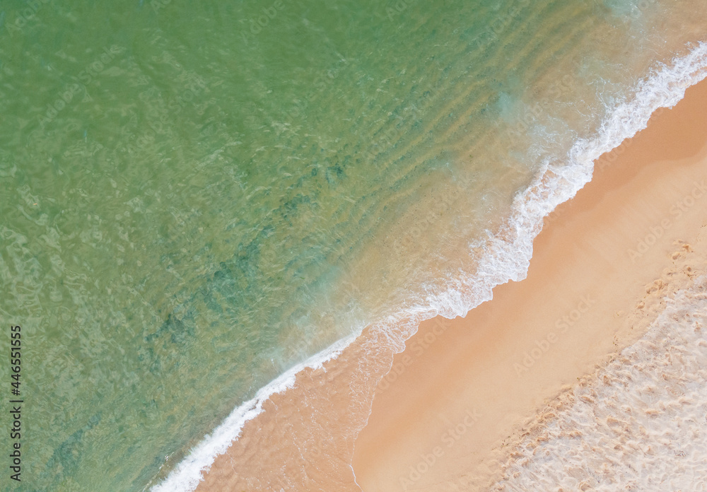 A ocean waves and beach aerial view, natural background.