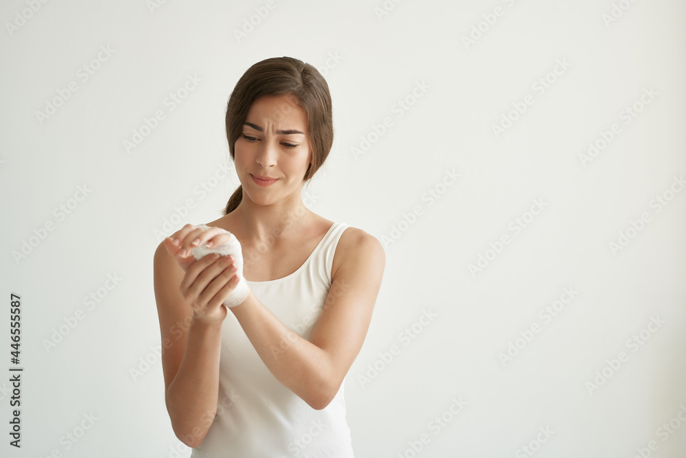 woman with bandaged arm injury health problems light background woman with bandaged arm injury health problems light background