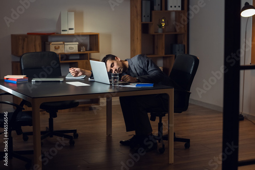 Tired businessman sleeping ...