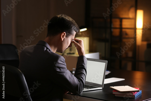 Tired businessman working in office late at night © Pixel-Shot