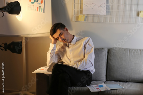 Tired sleepy businessman in...