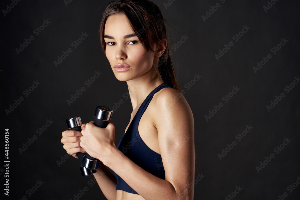 athletic woman with dumbbells in hands slim figure workout strength athletic woman with dumbbells in hands slim figure workout strength