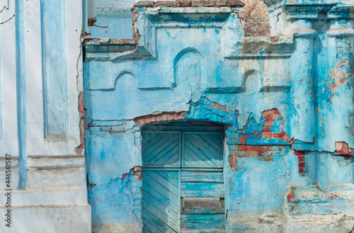 Ancient ruined blue building. Destroyed cyan house. Travel street photo. Turquoise weathered wall. © KawaiiS