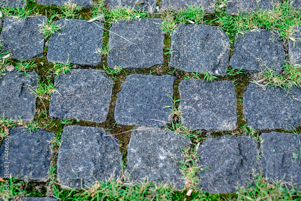 Obraz premium Old natural stone wall on background. Brick wall with ancient masonry. Full frame of rich and varied texture close up.